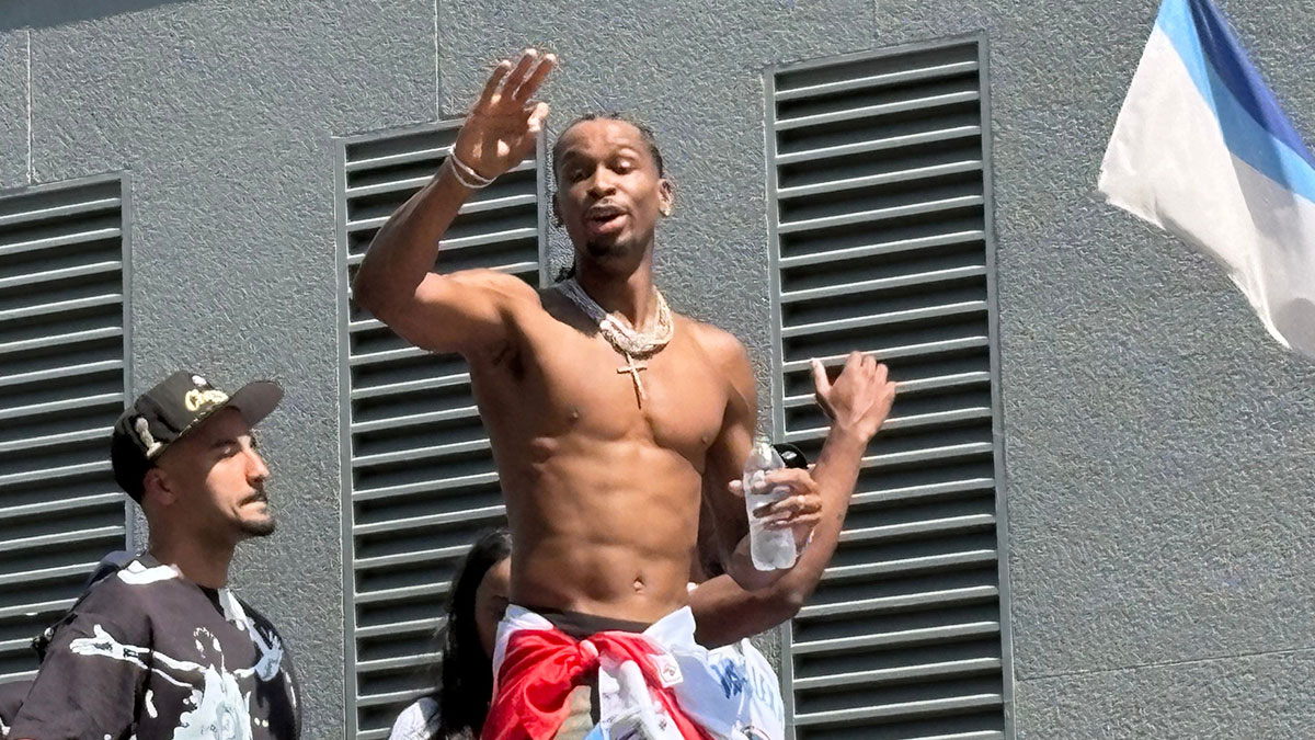 Thunder guard Shai Gilgeous Alexander waves to the crowd during the 2025 Champions Parade in Oklahoma City