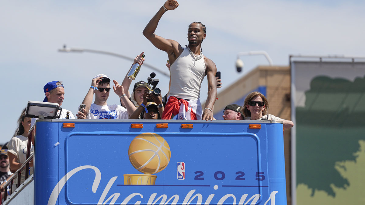Thunder guard Shai Gilgeous-Alexander gestures to the crowd as the Oklahoma City Thunder celebrate their first NBA Finals title win with a champions parade throughout downtown Oklahoma City on Tuesday, June 24, 2025