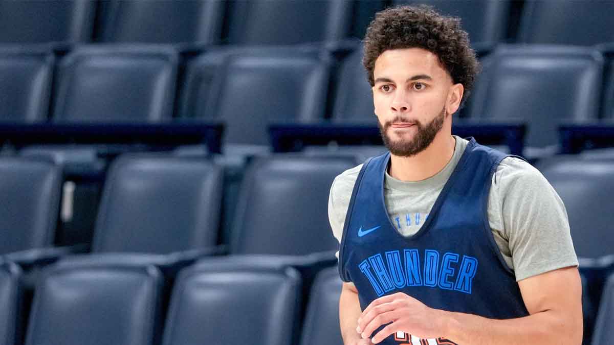Thunder guard Ajay Mitchell (25) runs drills during an NBA Finals practice session ahead of Game 2 at Paycom Center with Nikola Topic in the background