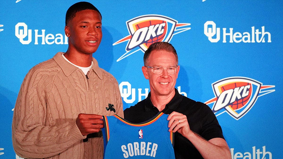 Thunder draft pick Thomas Sorber poses for a photo with general manager Sam Presti during a press conference at the First American's Museum in Oklahoma City