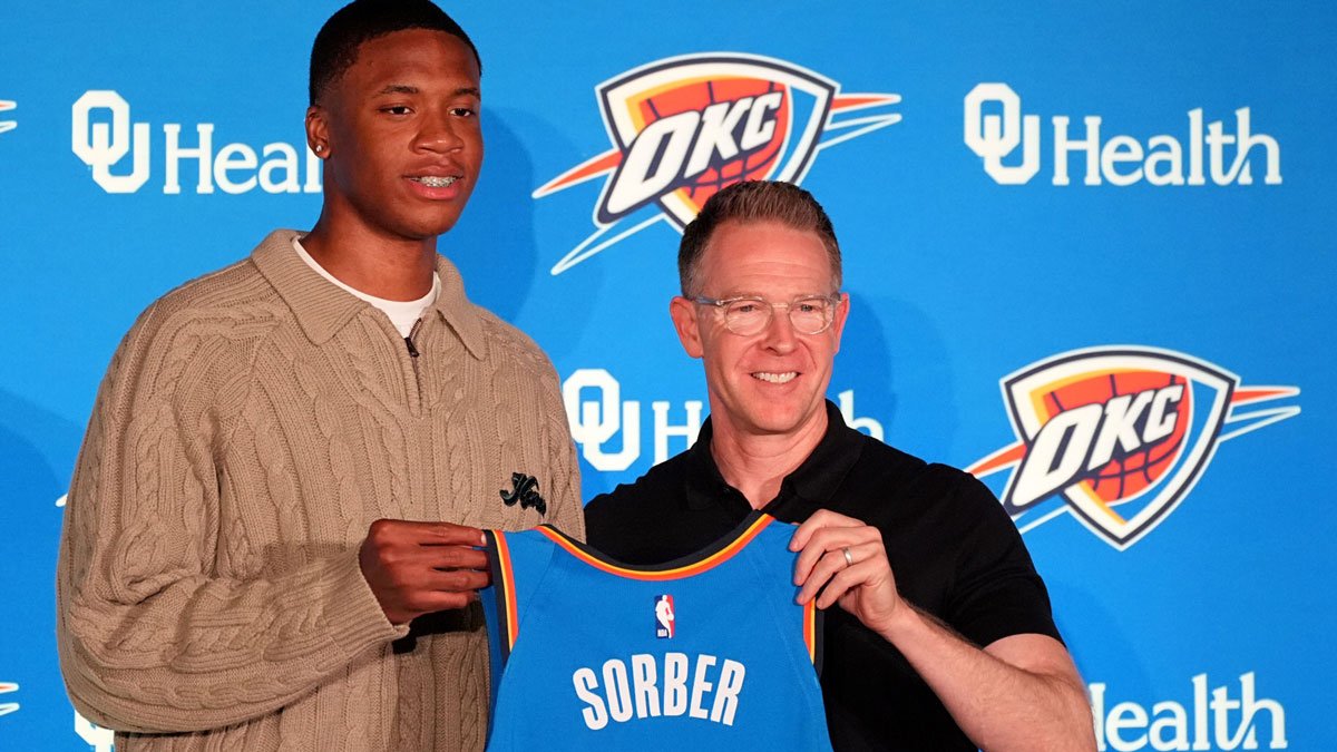 Thunder draft pick Thomas Sorber poses for a photo with general manager Sam Presti during a press conference at the First American's Museum in Oklahoma City