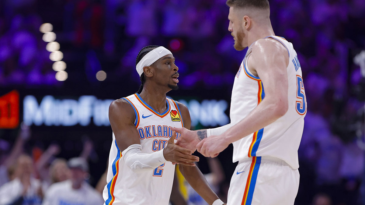 Thunder guard Shai Gilgeous-Alexander (2) and center Isaiah Hartenstein (55) celebrates making a basket against the Indiana Pacers during the first quarter during game one of the 2025 NBA Finals at Paycom Center