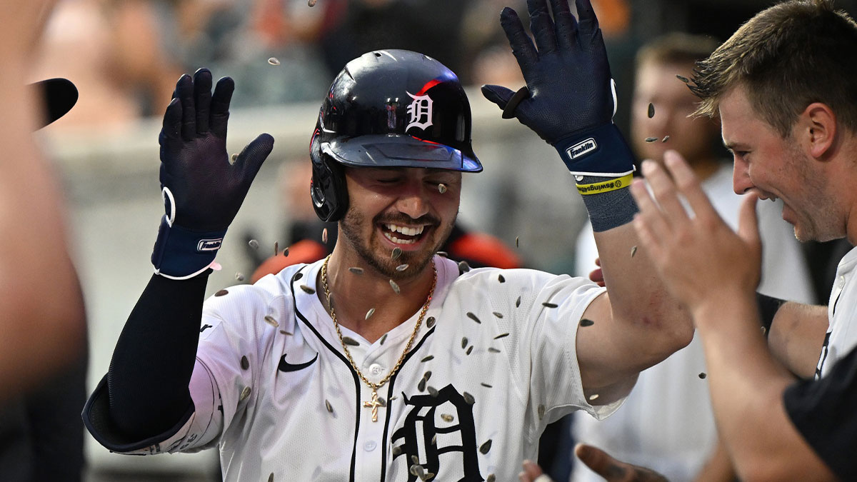 Detroit Tigers right fielder Zach McKinstry (39) gets showered with sunflower seeds as he celebrates in the dugout after hitting a home run against the Tampa Bay Rays in the seventh inning at Comerica Park.