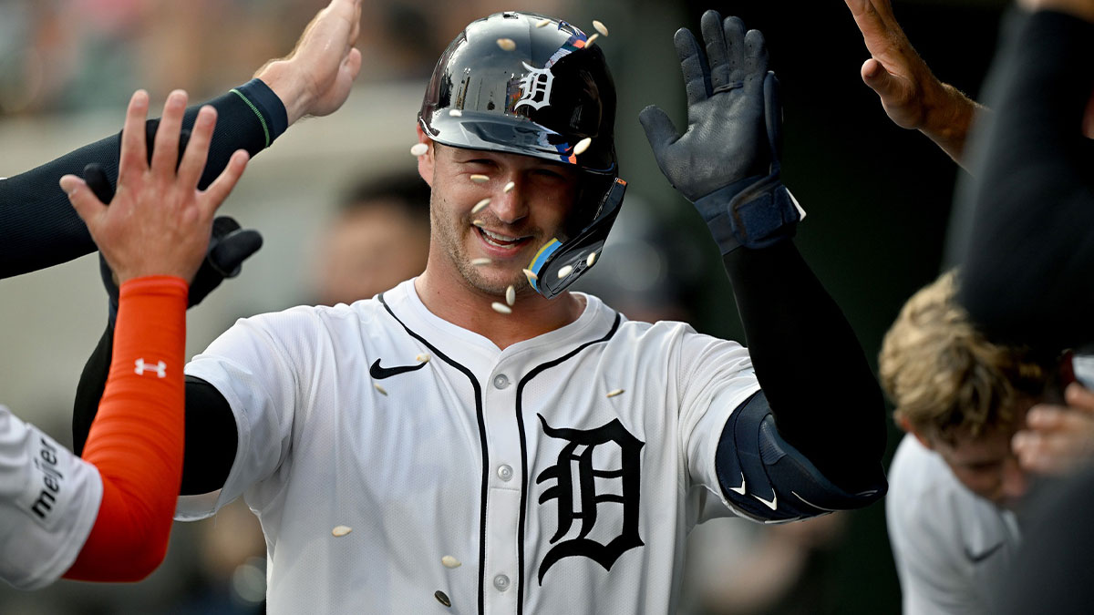 Detroit Tigers catcher Dillon Dingler (13) gets showered with sunflower seeds as he celebrates with his teammates in the dugout after hitting a solo home run against the Arizona Diamondbacks in the sixth inning at Comerica Park.