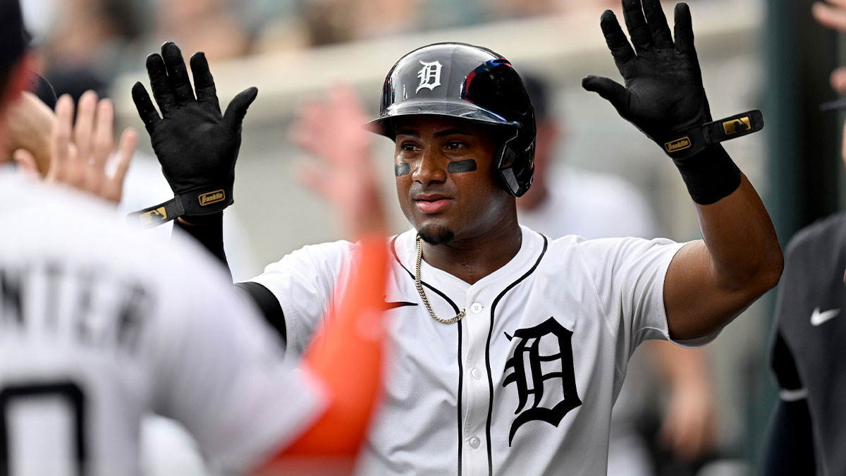 Detroit Tigers third baseman Andy Ibáñez (77) celebrates in the dugout after scoring a run against the Arizona Diamondbacks in the second inning at Comerica Park.