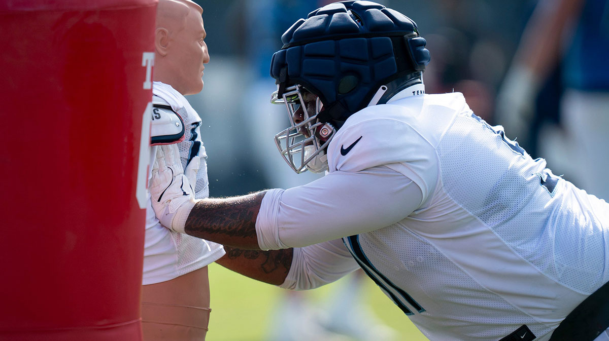Tennessee Titans defensive lineman Keondre Coburn (91) hits the dummy during the Tennessee Titans training camp at Ascension Saint Thomas Sports Park in Nashville, Tenn., Tuesday, July 30, 2024.