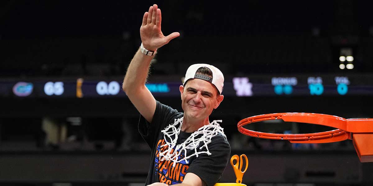 Florida Gators head coach Todd Golden reacts after cutting down a piece of the net after winning the national championship game of the Final Four of the 2025 NCAA Tournament at the Alamodome. 