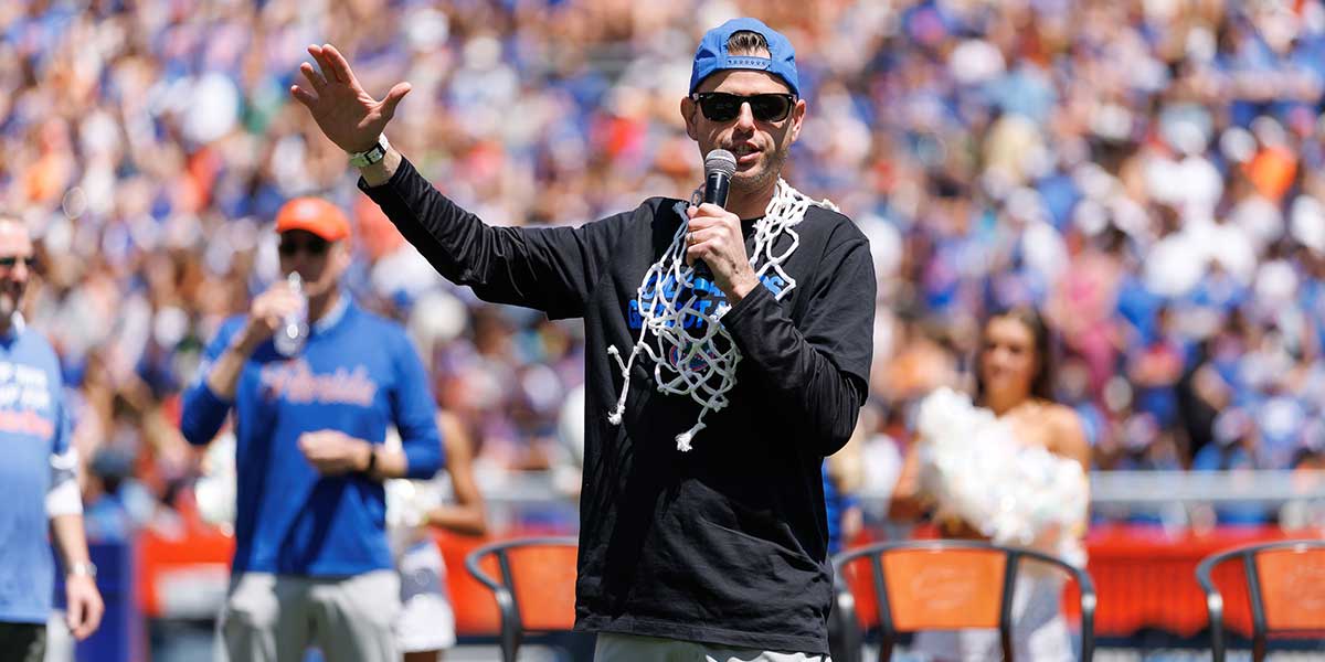 Florida Gators head coach Todd Golden gestures while speaking to the crowd during the National Championship celebration at Ben Hill Griffin Stadium.