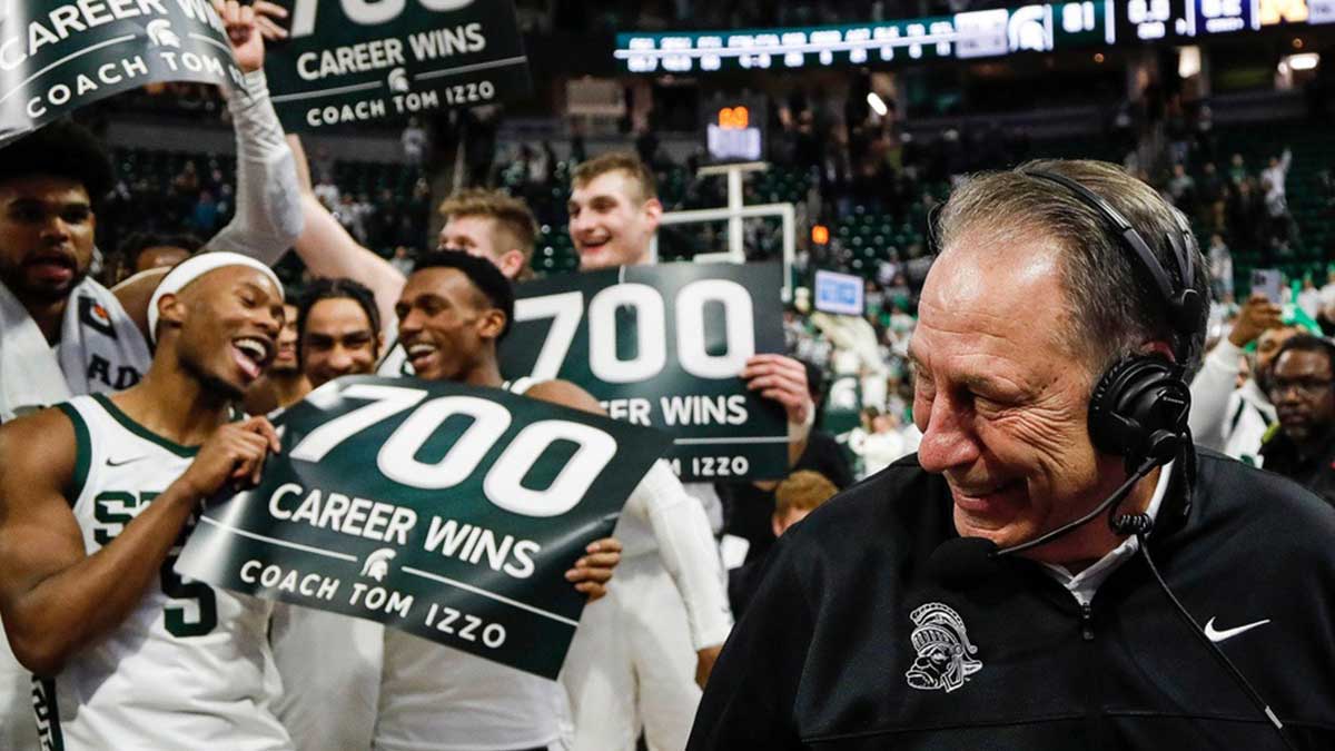 Michigan State players celebrate head coach Tom Izzo's 700 career win as head coach Tom Izzo is being interviewed after 81-62 win over Michigan at Breslin Center.