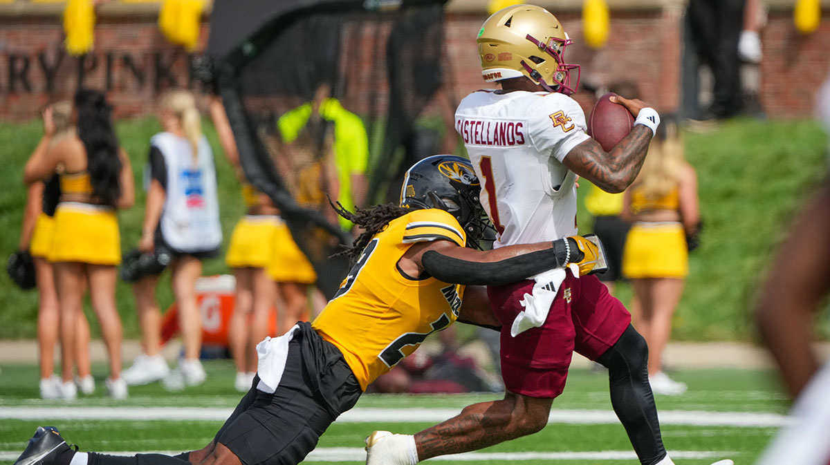 Boston College Eagles quarterback Thomas Castellanos (1) runs the ball as Missouri Tigers linebacker Khalil Jacobs (29) makes the tackle during the second half at Faurot Field at Memorial Stadium.