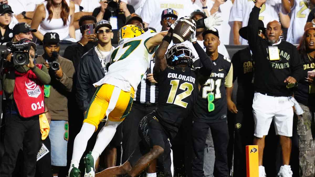 Colorado Buffaloes wide receiver Travis Hunter (12) pulls in a touchdown reception past North Dakota State Bison cornerback Jailen Duffie (17) in the second half at Folsom Field. Mandatory Credit: Ron Chenoy-Imagn Images