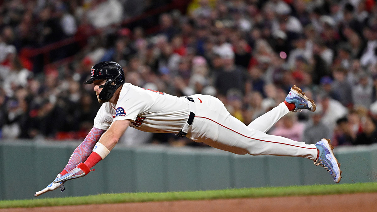Boston Red Sox shortstop Trevor Story (10) steals second base during the seventh inning against the Tampa Bay Rays at Fenway Park.