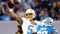 Los Angeles Chargers quarterback Trey Lance (5) throws a pass against the Detroit Lions in the first quarter at Tom Benson Hall of Fame Stadium.