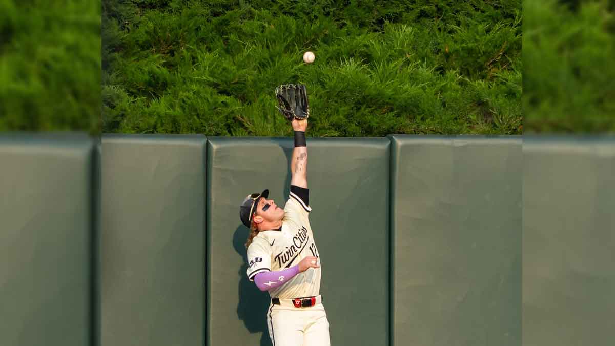 Minnesota Twins center fielder Harrison Bader (12) catches the ball for the out during the second inning against the Boston Red Sox at Target Field.