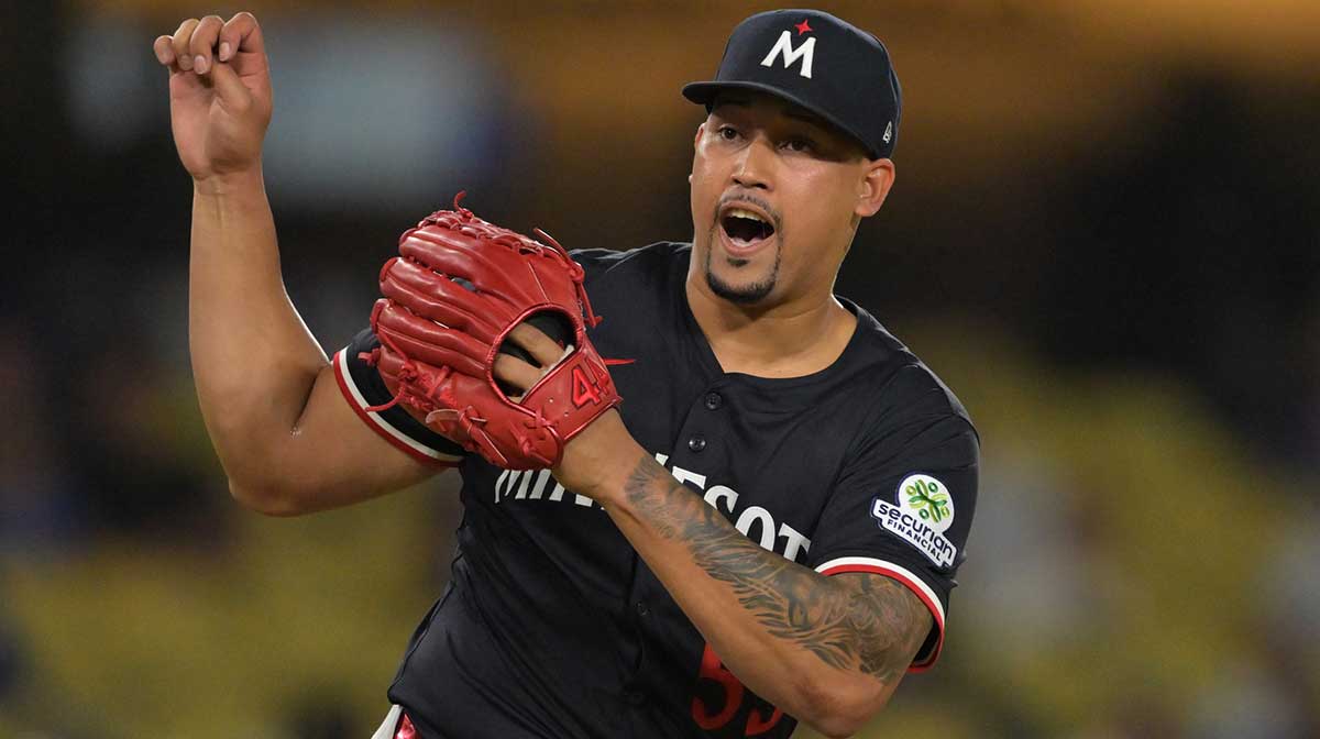Minnesota Twins relief pitcher Jhoan Duran (59) reacts after the final out of the ninth inning against the Los Angeles Dodgers at Dodger Stadium.