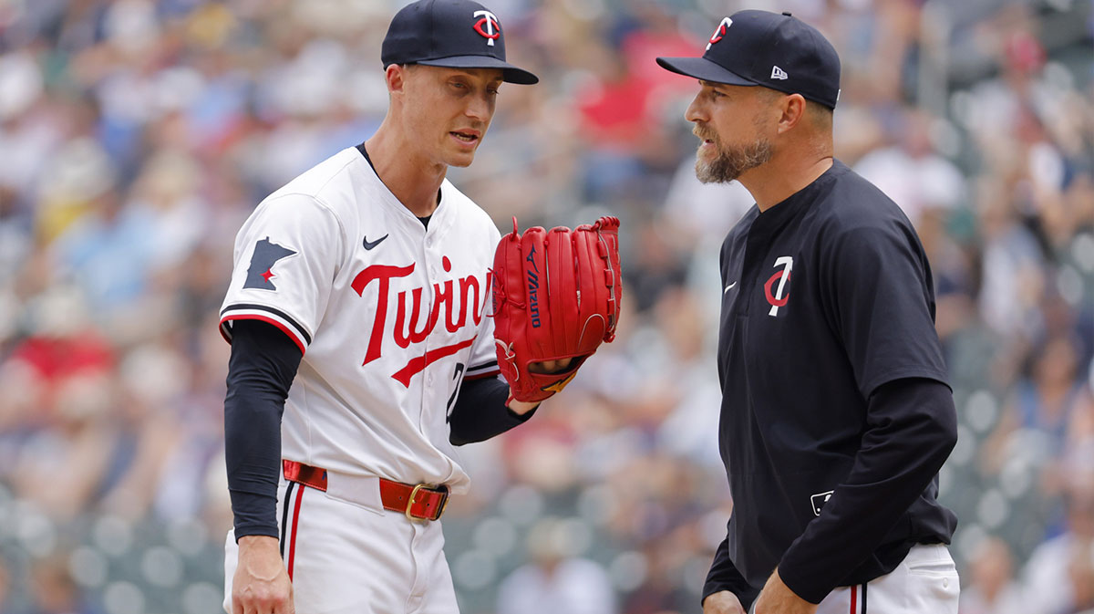 Minnesota Twins relief pitcher Griffin Jax (22) talks with manager Rocco Baldelli in the ninth inning of the game with the Boston Red Sox at Target Field. Baldelli then pulled Jax. Twins trade closer Duran to Phillies and explore Griffin Jax deal as MLB trade deadline nears.