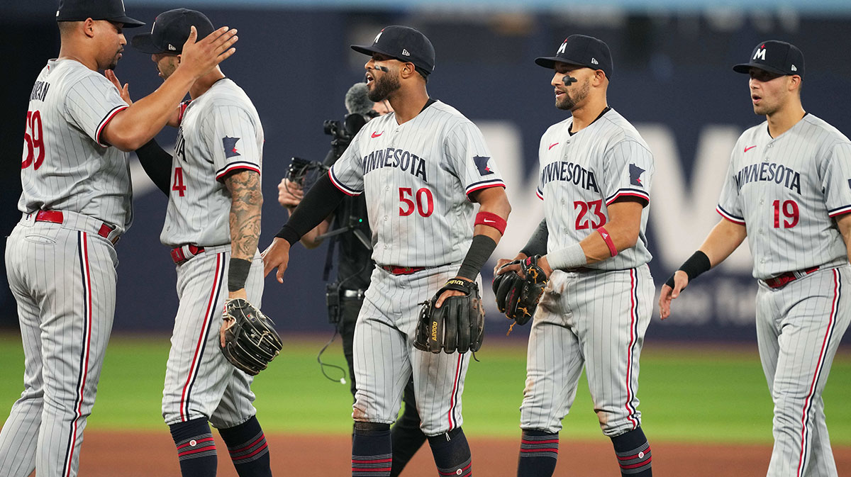 Minnesota Twins relief pitcher Jhoan Duran (59) celebrates the win with right fielder Willi Castro (50) against the Toronto Blue Jays at the end of the tenth inning at Rogers Centre. The Dodgers are rumored to be targeting Jhoan Duran, Willi Castro, and Griffin Jax from the Twins as the MLB Trade Deadline looms, aiming to reignite their World Series hopes.