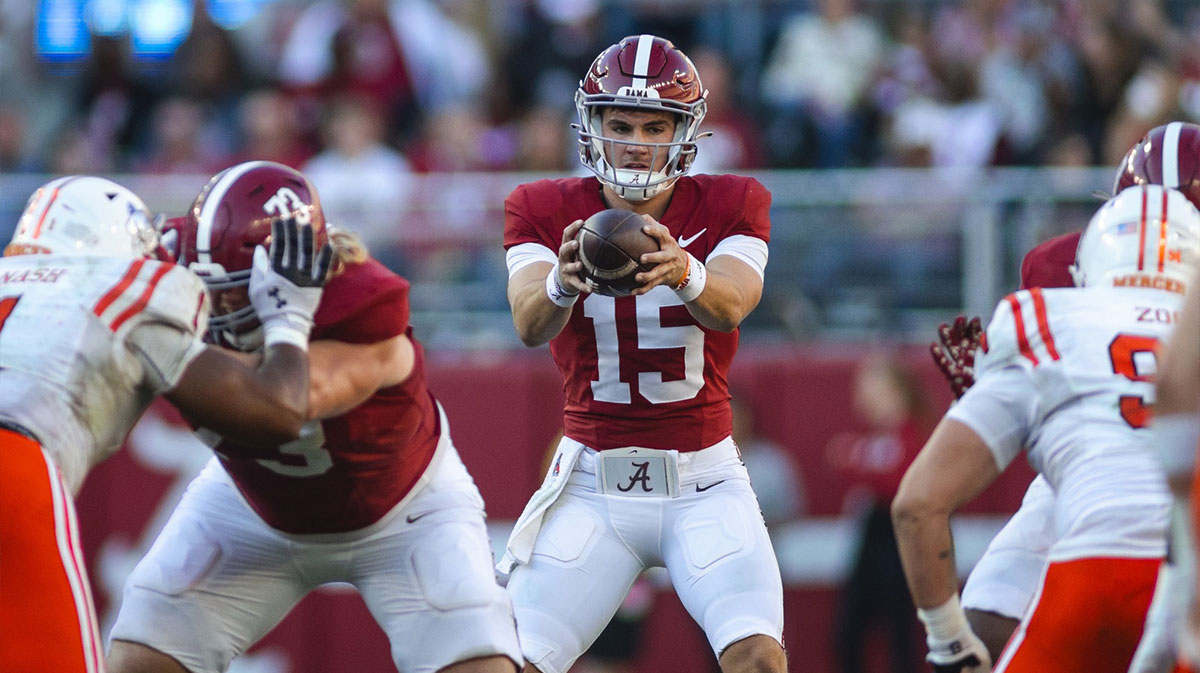 Alabama Crimson Tide quarterback Ty Simpson (15) receives a snapped ball against the Mercer Bears during the third quarter at Bryant-Denny Stadium.