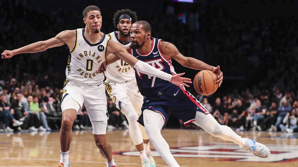 Brooklyn Nets forward Kevin Durant (7) drives past Indiana Pacers guard Tyrese Haliburton (0) in the fourth quarter at Barclays Center.