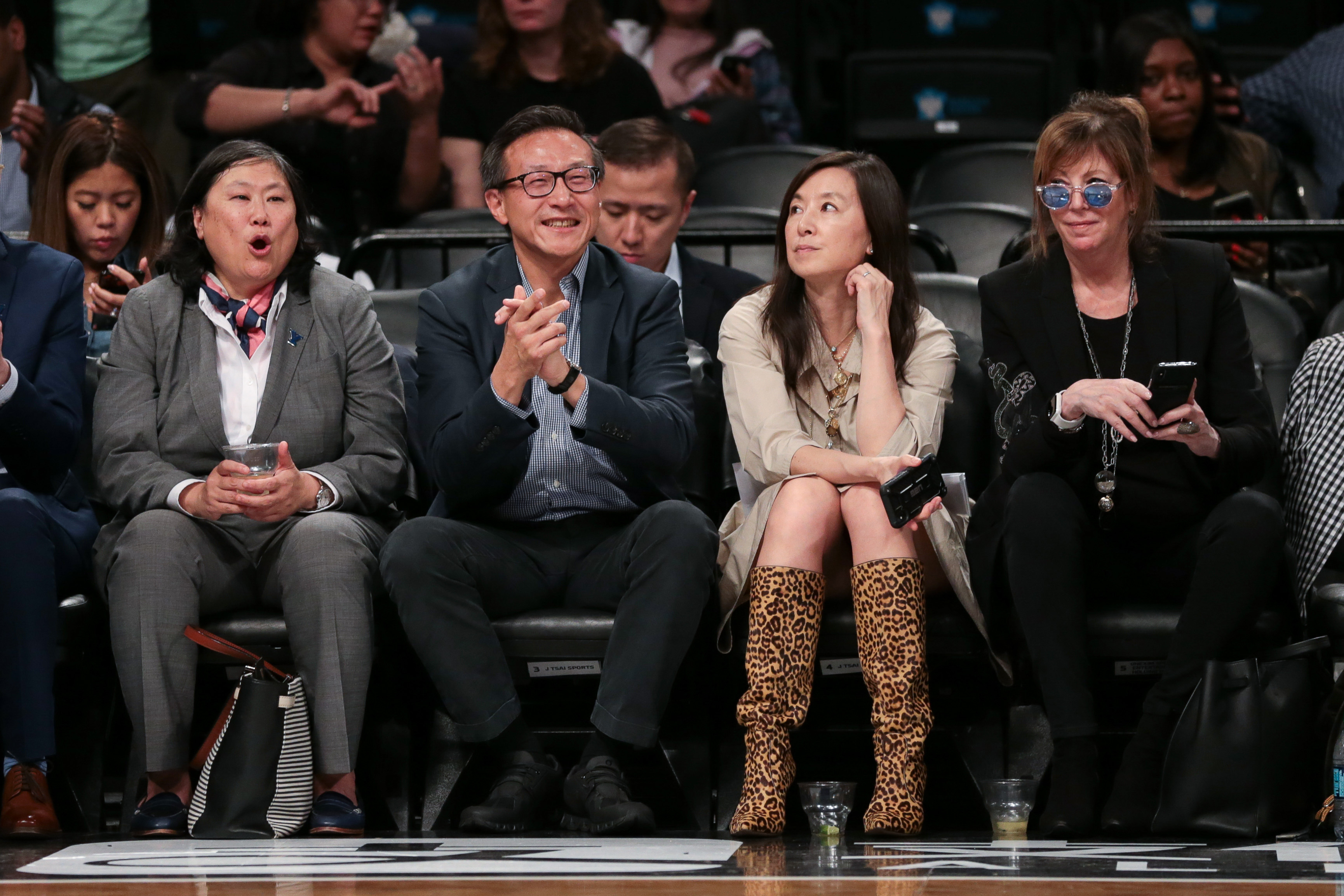 Taiwanese businessman Joe Tsai cheers during the second half of the preseason WNBA game between the New York Liberty and the China National Team at Barclays Center.