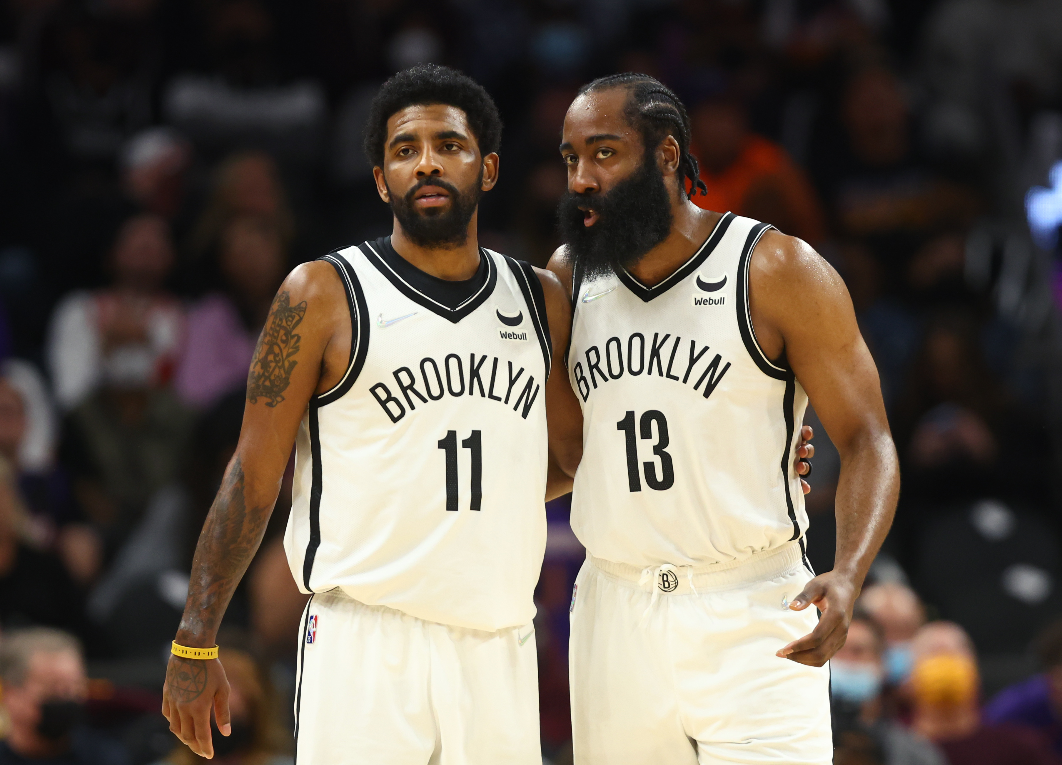 Brooklyn Nets guard Kyrie Irving (11) and guard James Harden (13) against the Phoenix Suns at Footprint Center.