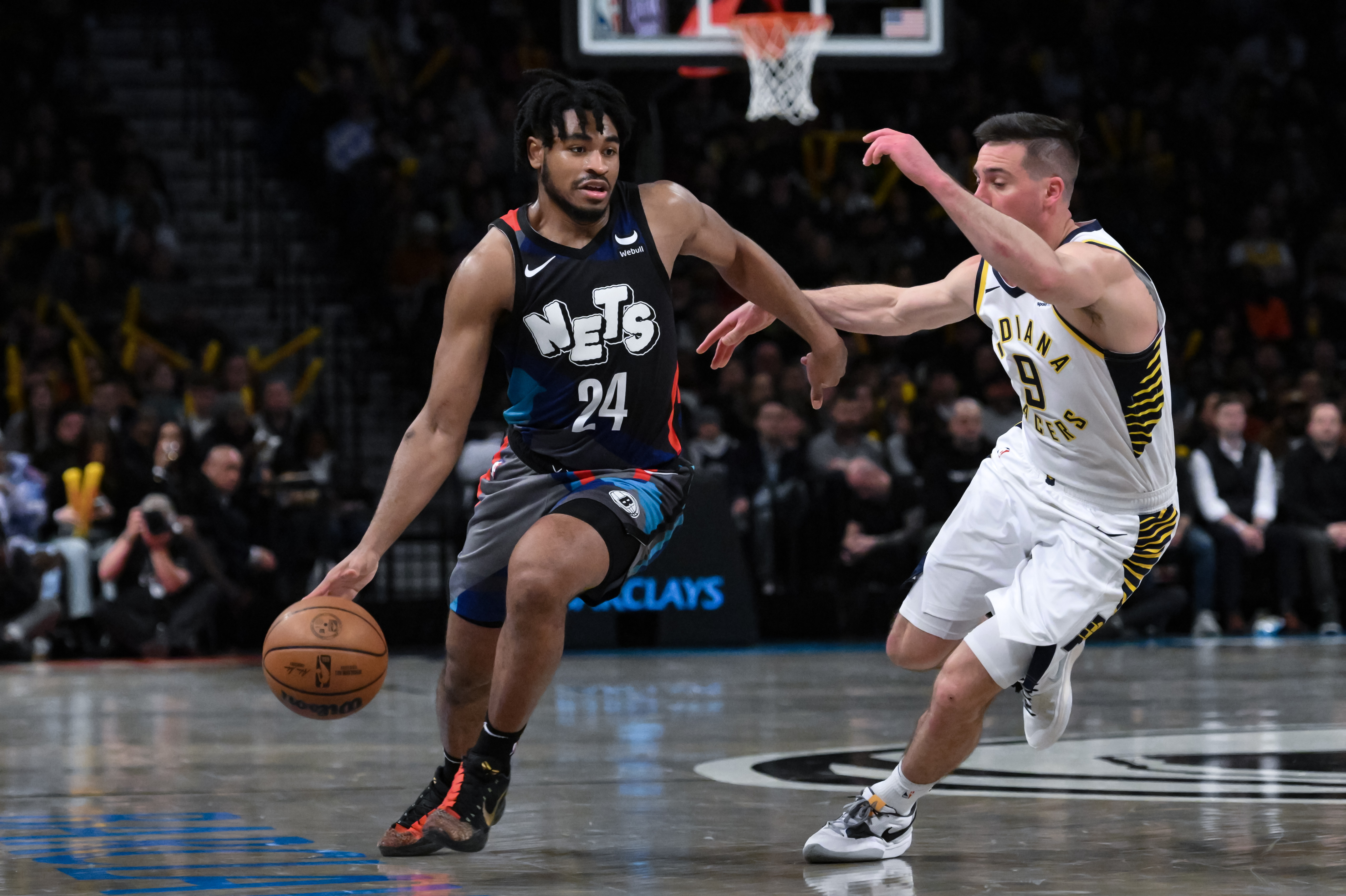 Brooklyn Nets guard Cam Thomas (24) drives to the basket while being defended by Indiana Pacers guard T.J. McConnell (9) during the third quarter at Barclays Center.