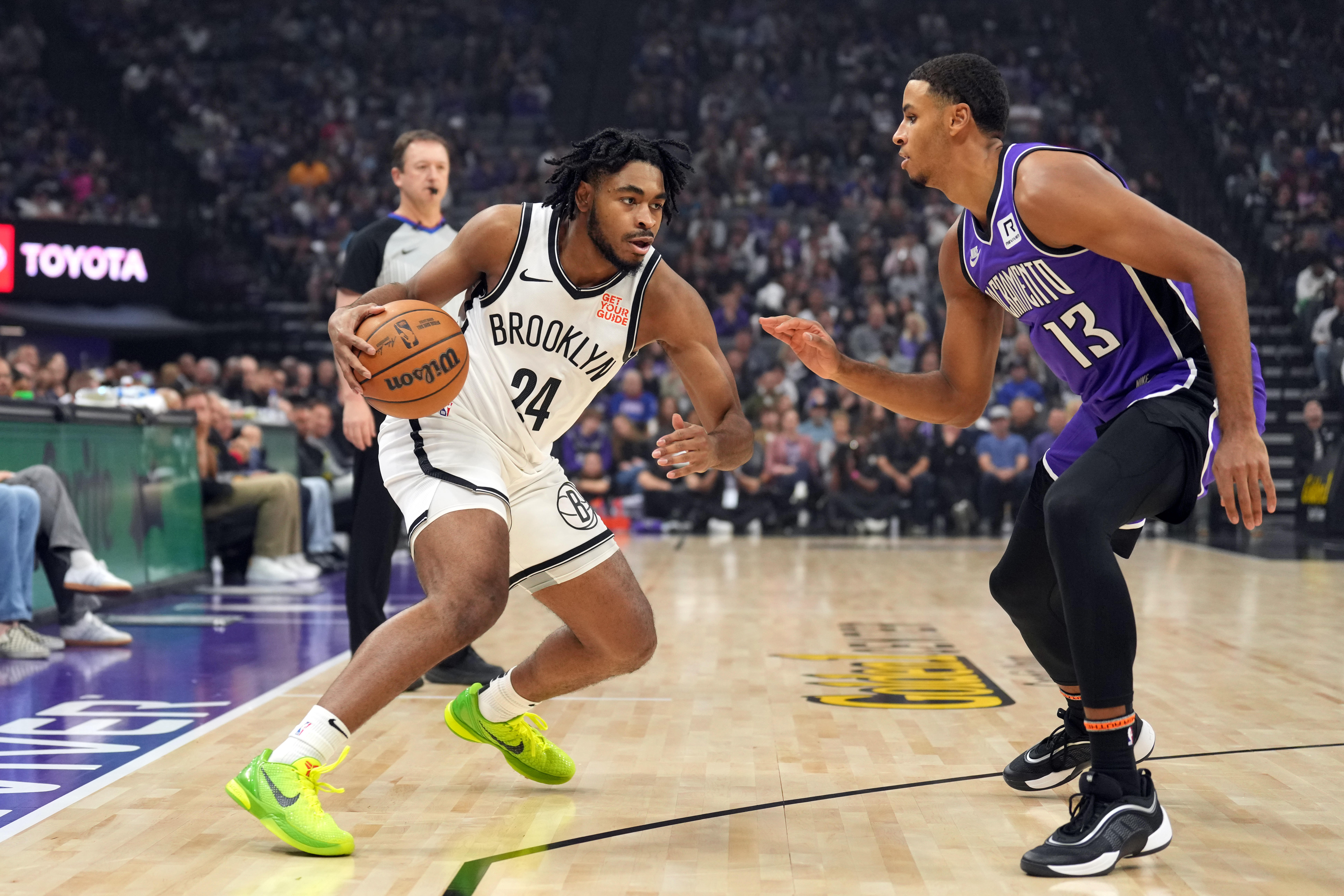 Brooklyn Nets guard Cam Thomas (24) dribbles against Sacramento Kings forward Keegan Murray (13) during the first quarter at Golden 1 Center.