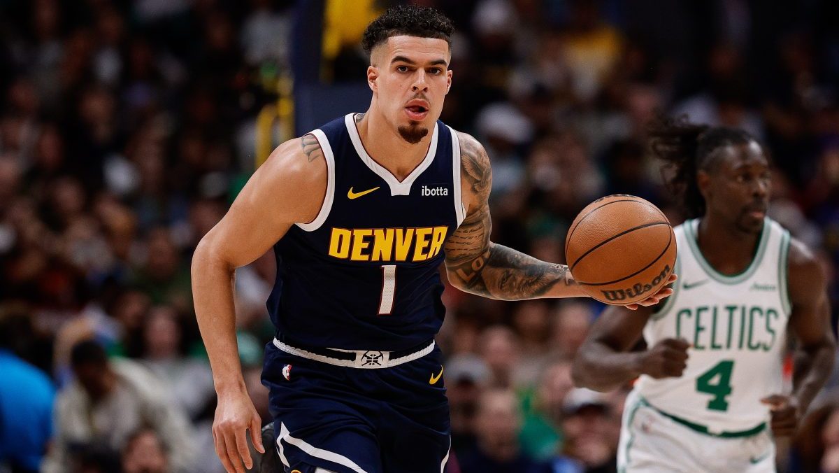 Denver Nuggets forward Michael Porter Jr. (1) dribbles the ball up court in the first quarter against the Boston Celtics at Ball Arena.