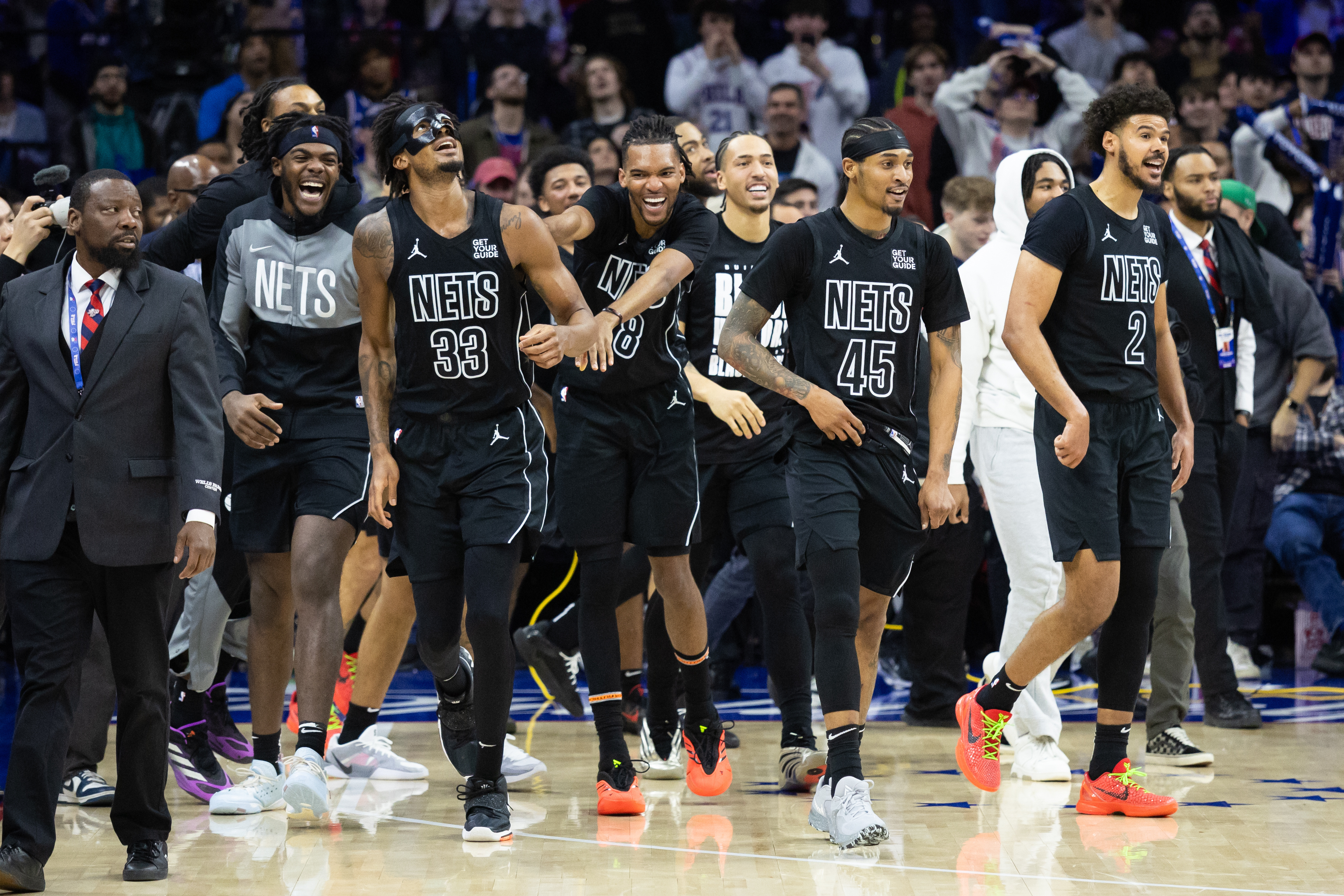 Brooklyn Nets center Nic Claxton (33) celebrates with teammates after hitting a game winning shot against the Philadelphia 76ers as time expired in fourth quarter at Wells Fargo Center.