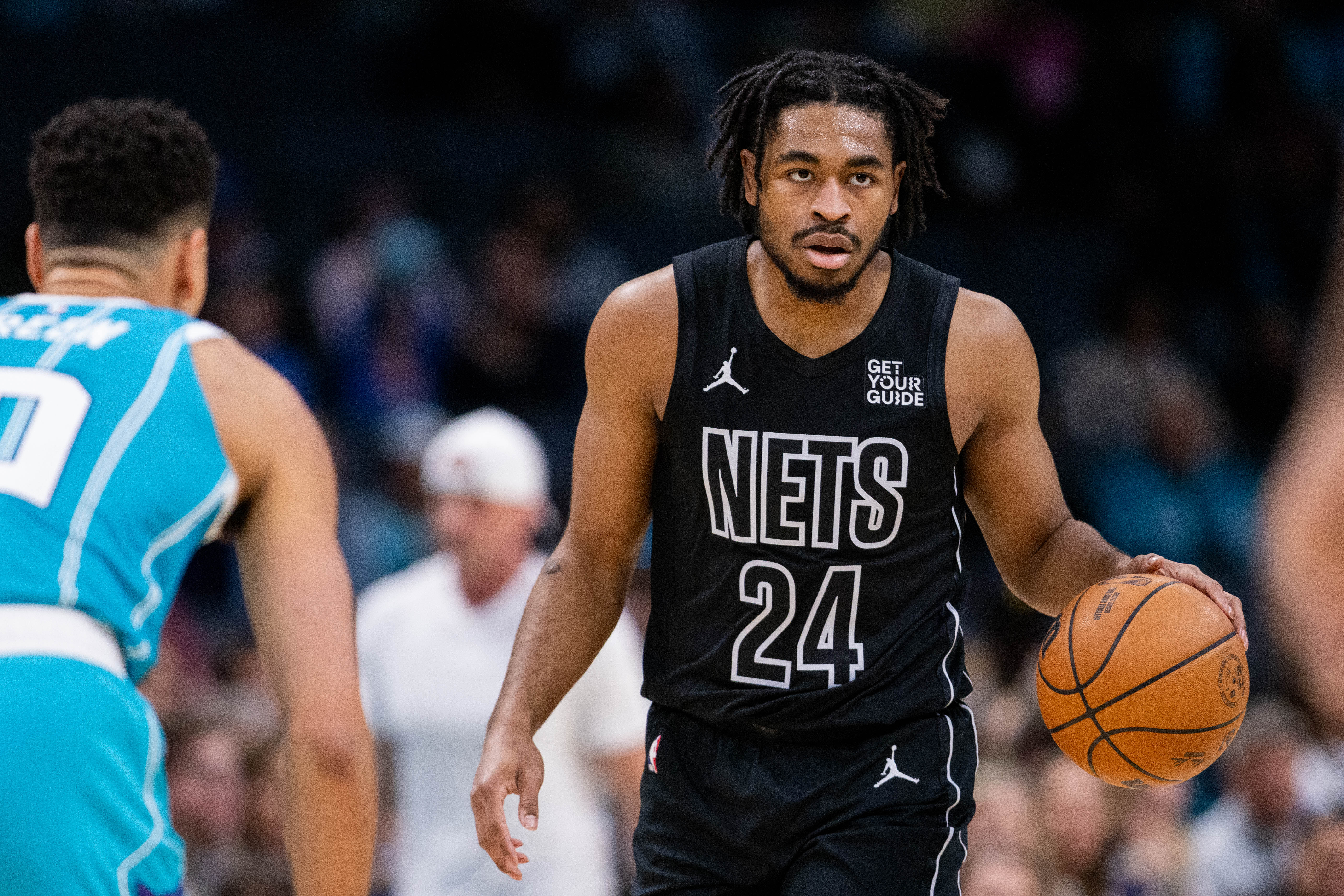 Brooklyn Nets guard Cam Thomas (24) brings the ball up court against the Charlotte Hornets during the first quarter at Spectrum Center.