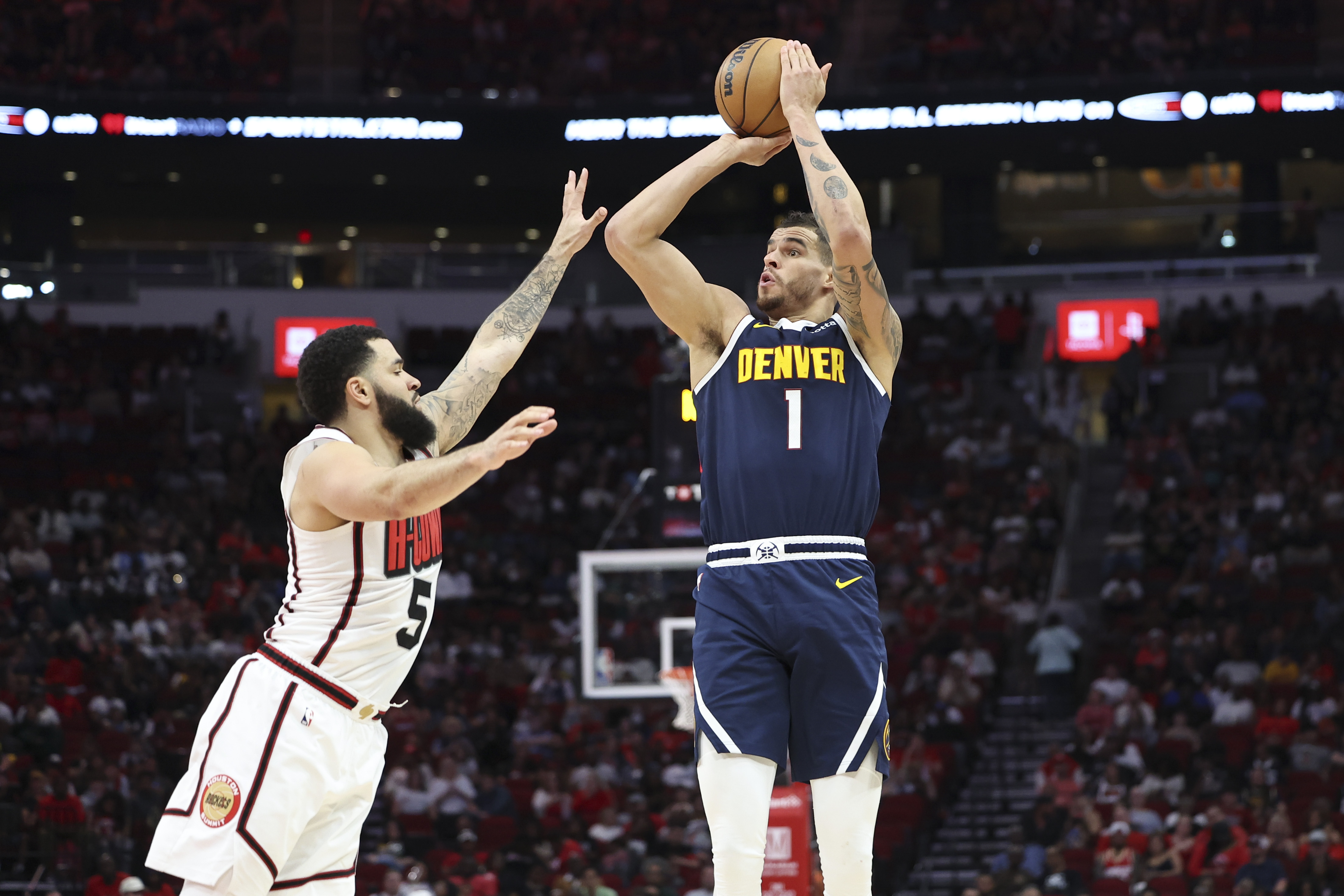 Denver Nuggets forward Michael Porter Jr. (1) shoots the ball as Houston Rockets guard Fred VanVleet (5) defends during the third quarter at Toyota Center.