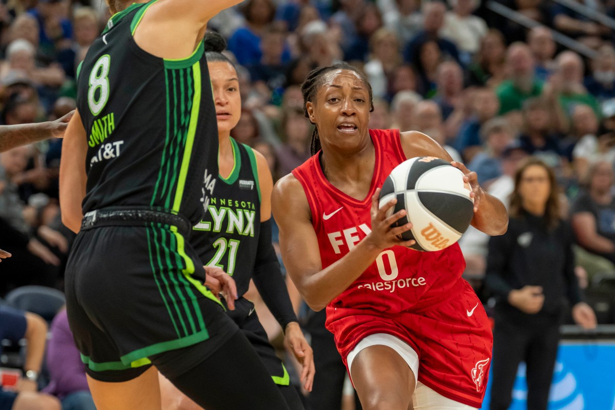 Indiana Fever guard Kelsey Mitchell (0) drives to the basket against the Minnesota Lynx in the first half during the Commissioner's Cup final at Target Center.
