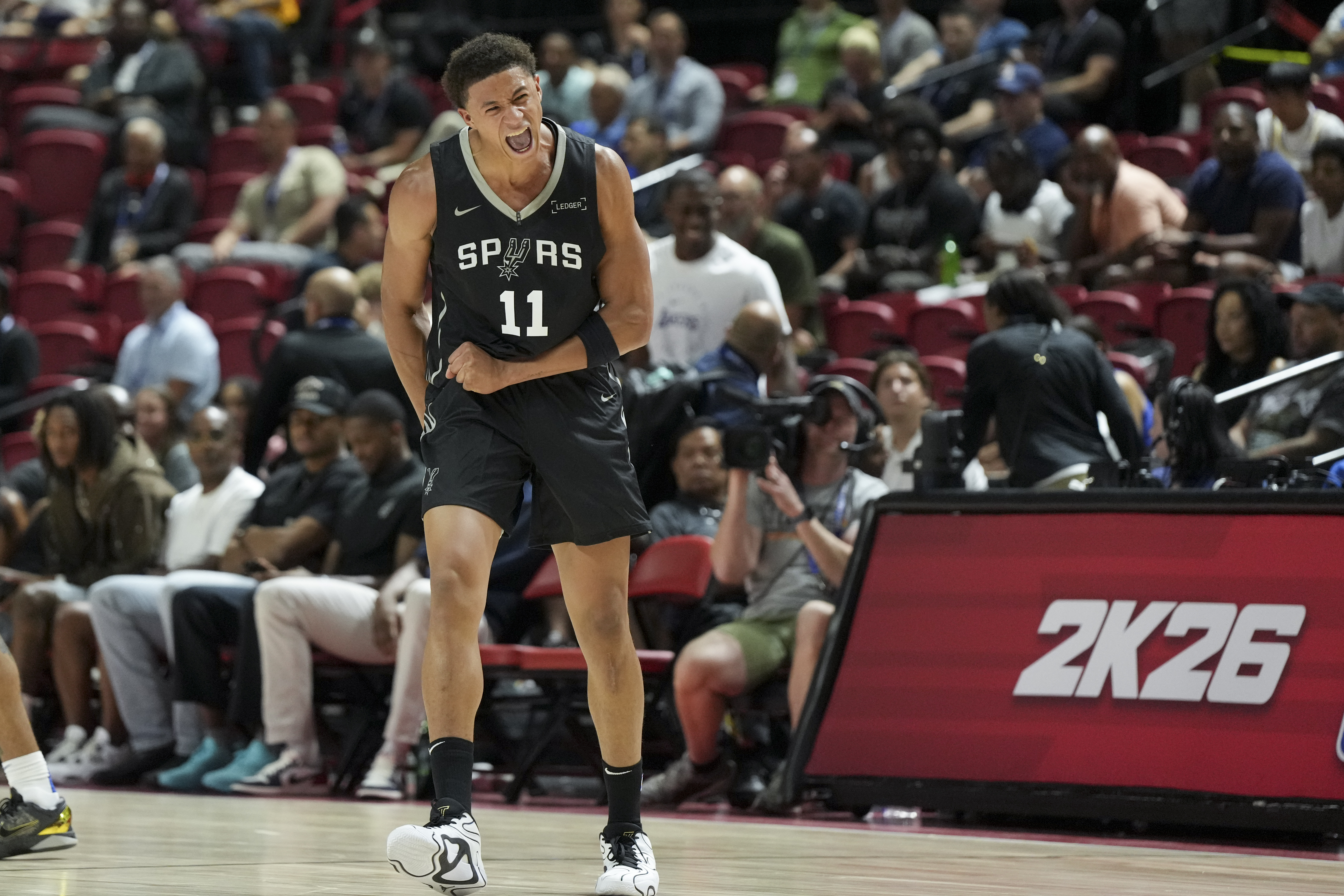 San Antonio Spurs forward Carter Bryant (11) reacts to a play against the Philadelphia 76ers in the first quarter of their game at Thomas & Mack Center.
