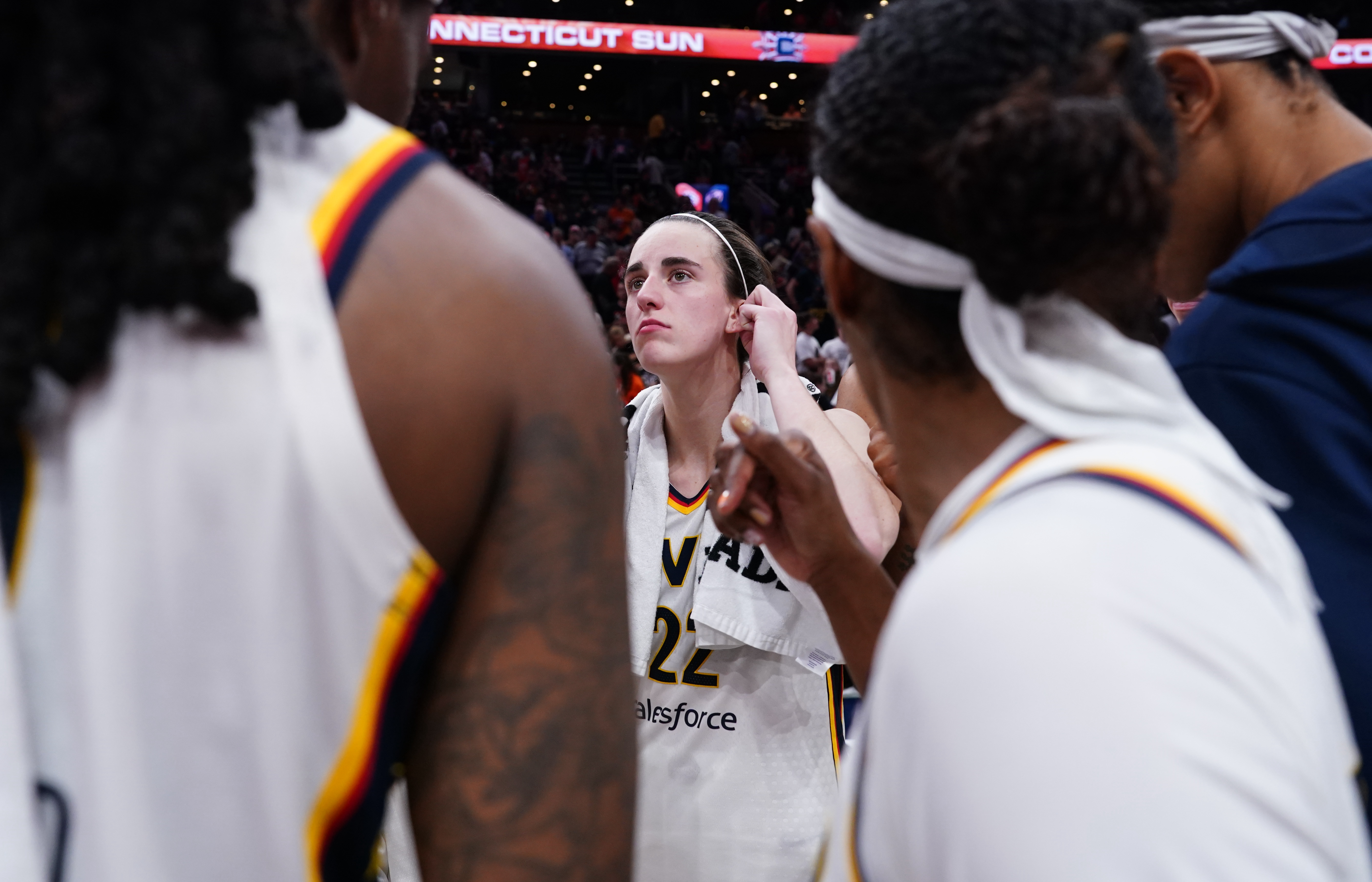 Indiana Fever guard Caitlin Clark (22) on the court with teammates after defeating the Connecticut Sun at TD Garden.