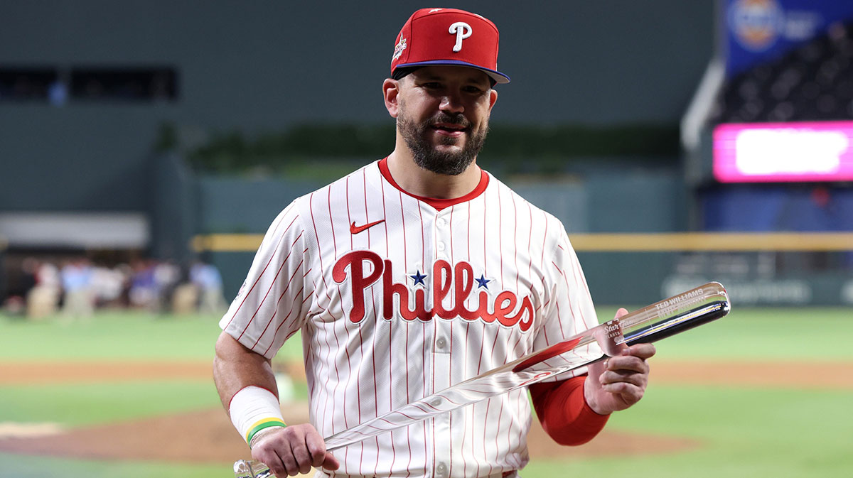 National League designated hitter Kyle Schwarber (12) of the Philadelphia Phillies celebrates with the MVP trophy after defeating the American League in the 2025 MLB All Star Game at Truist Park.