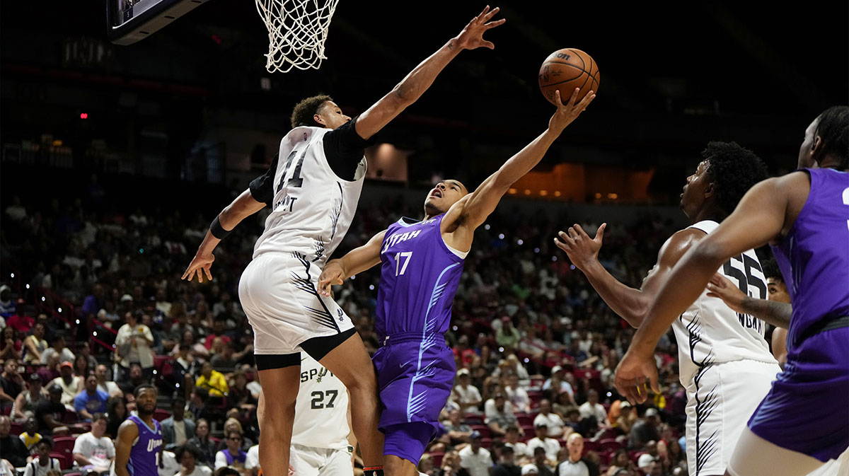 Utah Jazz forward John Tonje (17) drives towards the basket against San Antonio Spurs forward Carter Bryant (11) during the first half of a NBA basketball game at the Thomas & Mack Center.