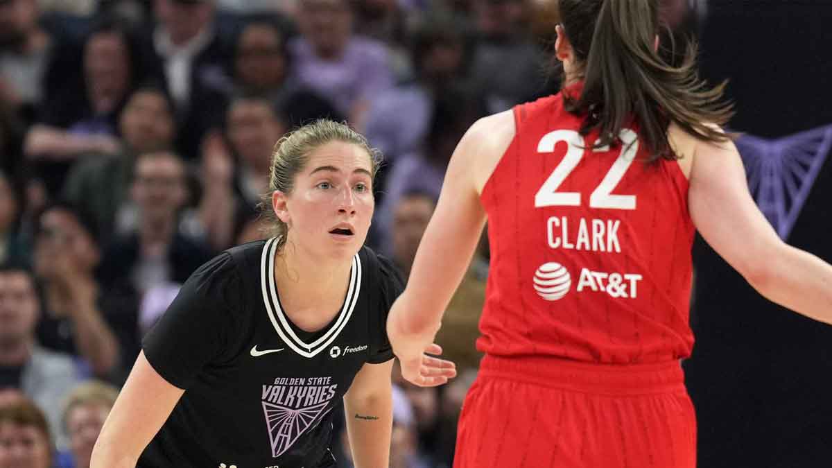 Golden State Valkyries guard Kate Martin (left) defends against Indiana Fever guard Caitlin Clark (22) during the second quarter at Chase Center.