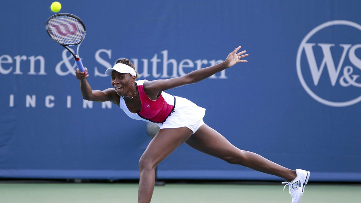 Venus Williams lunges for a shot during her 6-2, 6-7 (2), 6-4 quarterfinal victory over Sam Stosure Friday afternoon. Venus is in the semifinals here for the first time. The Enquirer/Cara Owsley Venus Williams returns a serve from Samantha Stosur on the grandstand during the Western and Southern Open at the Lindner Family Tennis Center.