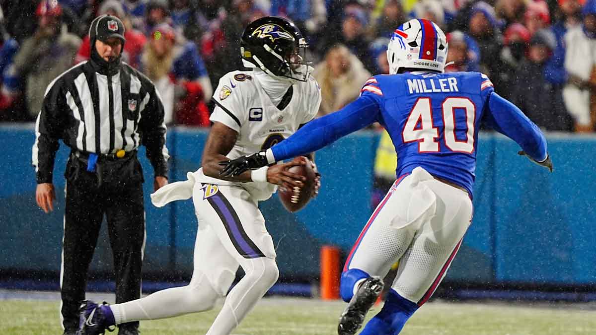 Baltimore Ravens quarterback Lamar Jackson scrambles looking for a player to pass to as Buffalo Bills linebacker Von Miller rushes towards him during first half action at the Buffalo Bills divisional game against the Baltimore Ravens at Highmark Stadium in Orchard Park on Jan. 19, 2025.