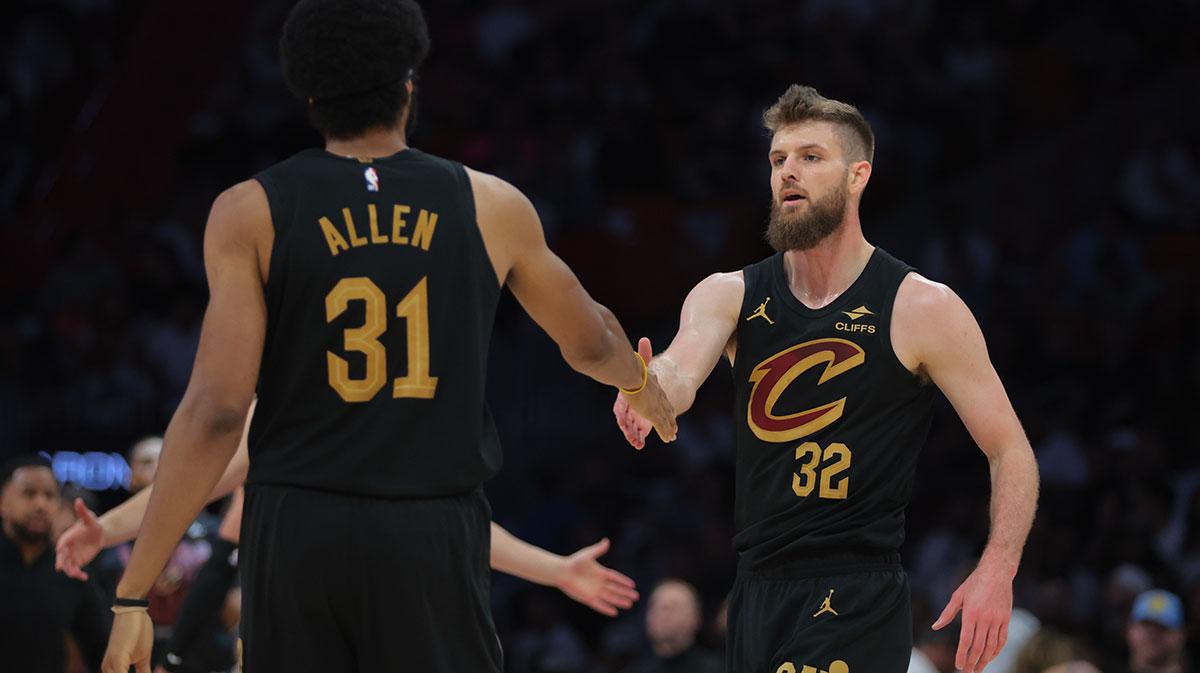 Cleveland Cavaliers forward Dean Wade (32) shakes hands with center Jarrett Allen (31) in the second quarter during game four for the first round of the 2025 NBA Playoffs against the Miami Heat at Kaseya Center.