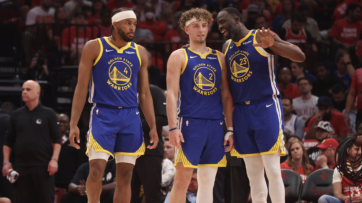Golden State Warriors forward Draymond Green (23) talks to guard Brandin Podziemski (2) and guard Moses Moody (4) before playing against the Houston Rockets in the second quarter during game five of first round for the 2025 NBA Playoffs at Toyota Center.