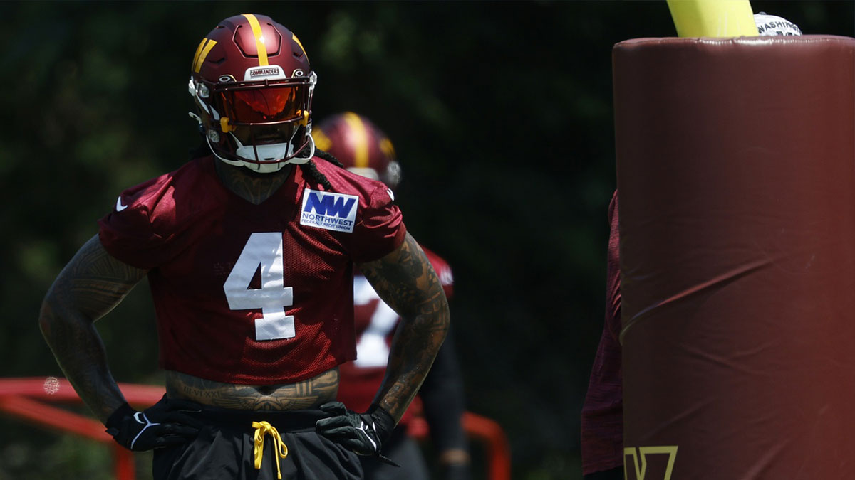 Washington Commanders linebacker Frankie Luvu (4) stands on the field during drills on day one of minicamp at Commanders Park.