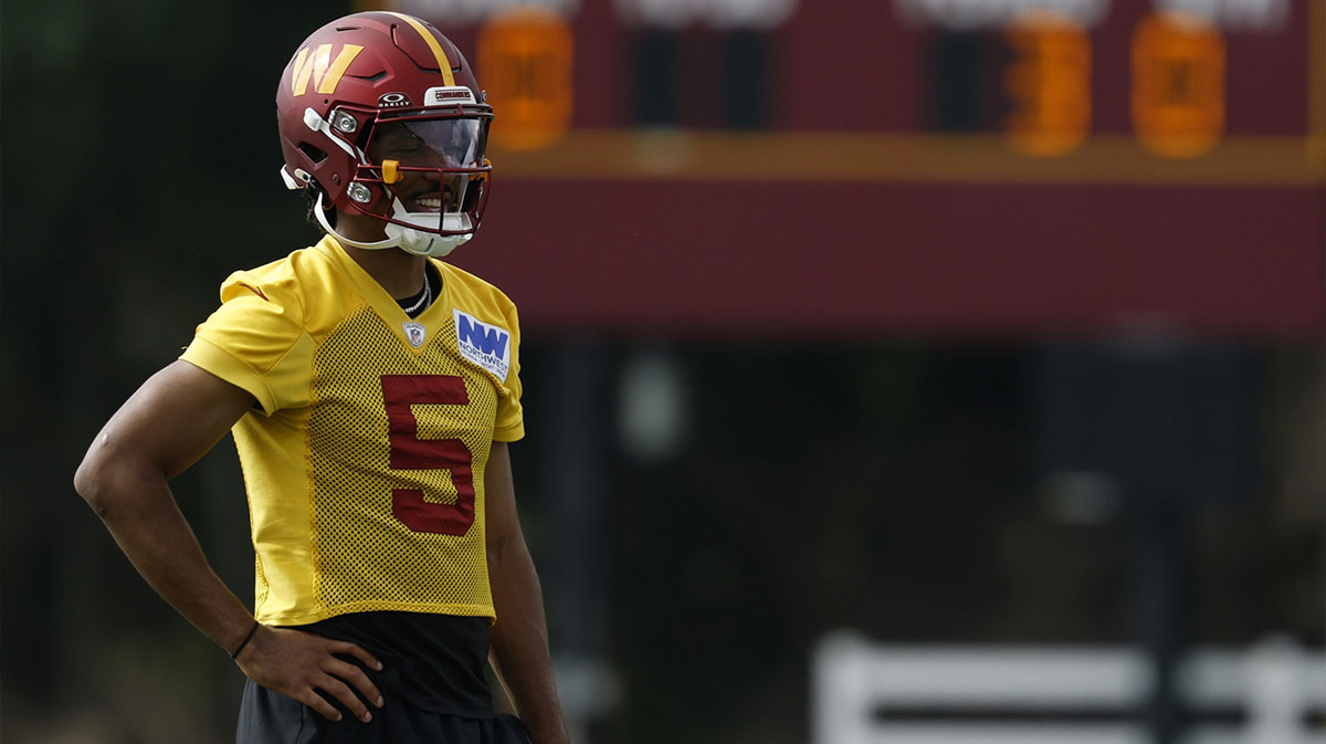 Washington Commanders quarterback Jayden Daniels (5) looks on during practice on day one of training camp at OrthoVirginia Training Center at Commanders Park.