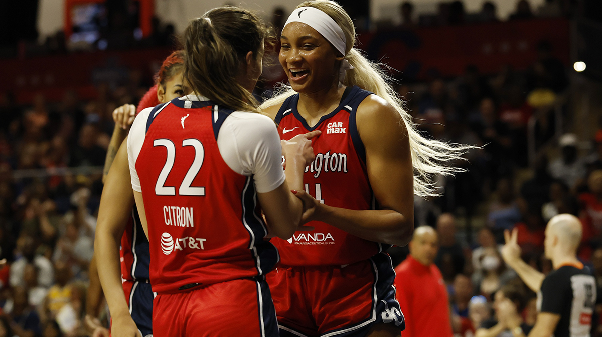 Washington Mystics guard Sonia Citron (22) celebrates with Mystics forward Kiki Iriafen (44) after scoring while being fouled against the Dallas Wings in the second half at Entertainment & Sports Arena.