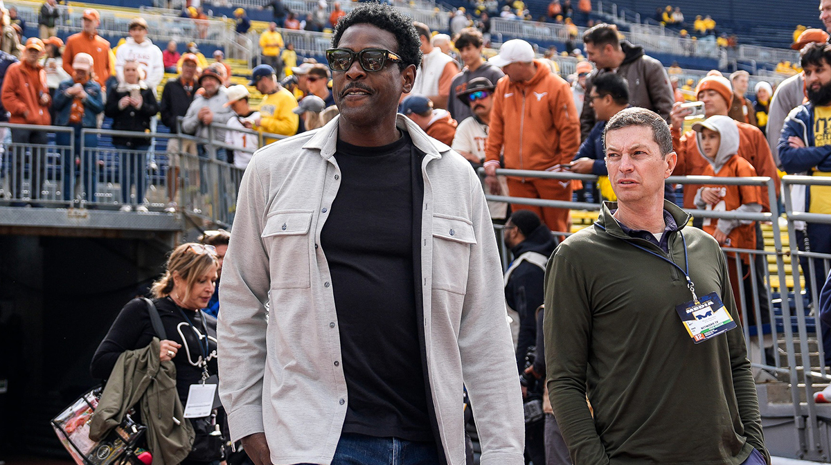 Michigan basketball legend Chris Webber walks out of the tunnel to watch warm up before Texas game at Michigan Stadium in Ann Arbor on Saturday, September 7, 2024.