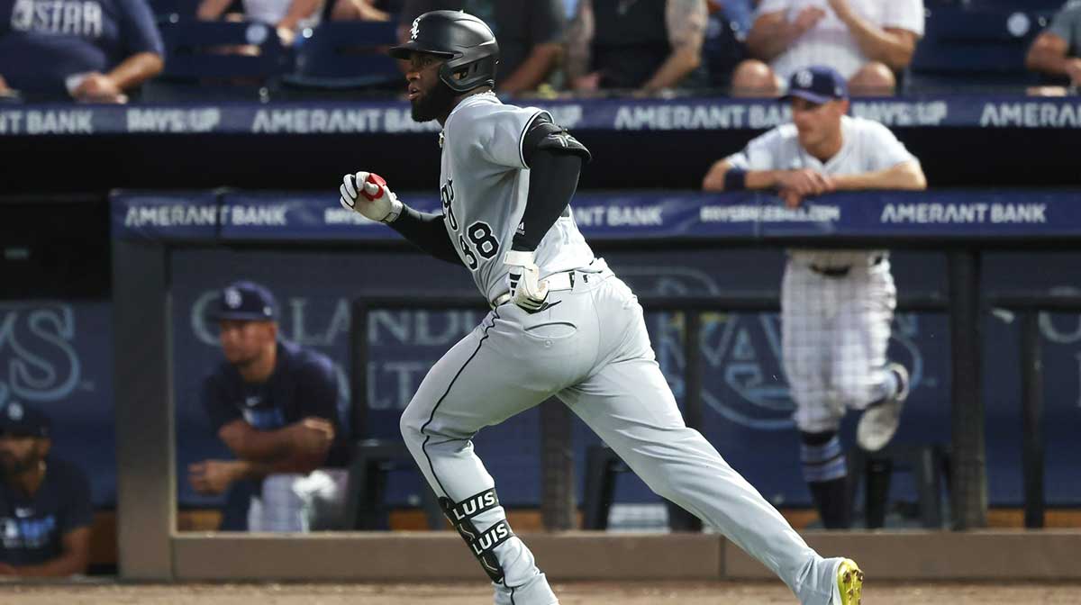 Chicago White Sox outfielder Luis Robert Jr. (88) hits a 2 RBI single during the third inning against the Tampa Bay Rays at George M. Steinbrenner Field.