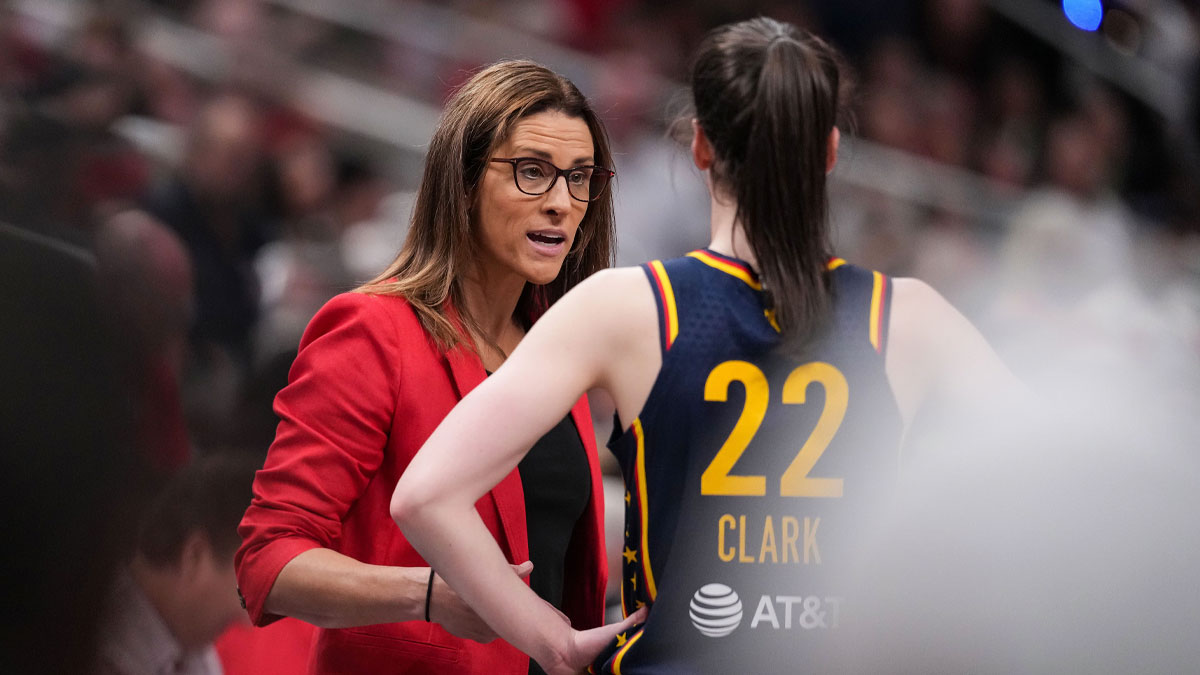 Indiana Fever guard Caitlin Clark (22) talks to Indiana Fever head coach Stephanie White on Sunday, July 13, 2025, during the game at Gainbridge Fieldhouse in Indianapolis.
