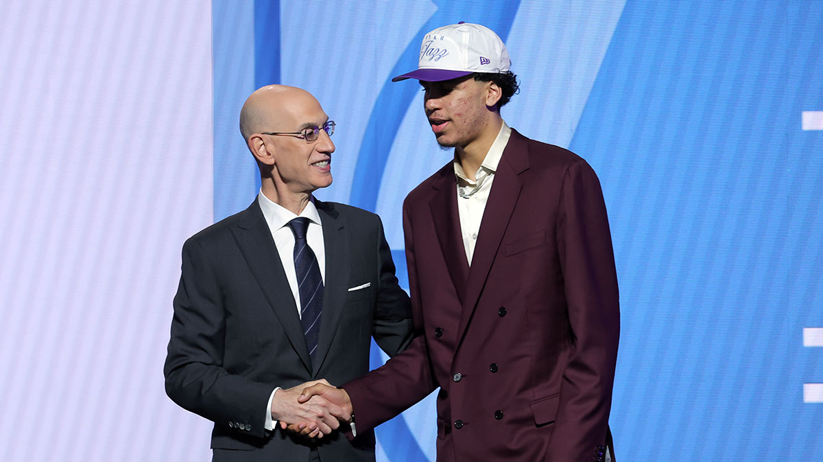 Will Riley stands with NBA commissioner Adam Silver after being selected as the 21st pick by the Utah Jazz in the first round of the 2025 NBA Draft at Barclays Center.