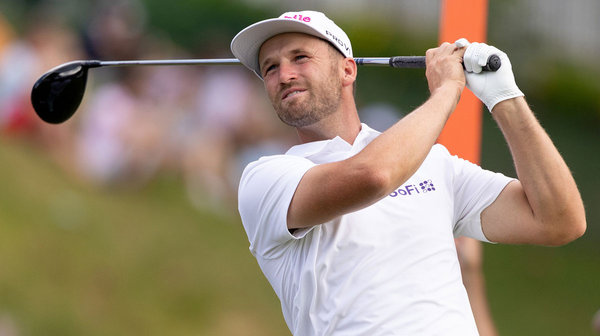 Wyndham Clark plays his shot from the 18th tee during the third round of the Travelers Championship golf tournament