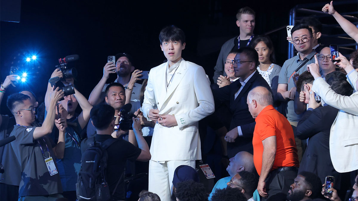 Yang Hansen walks to the stage after being selected as the 16th pick by the Memphis Grizzlies in the first round of the 2025 NBA Draft at Barclays Center.